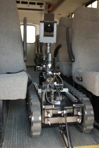 CALIBER® T5 swat EOD robot driving down aisle
